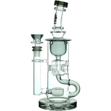 The Calibear Cascade Flower Of Life Klein Recycler Dab Rig has a clear glass build, multiple chambers, a Flower of Life perc, angled mouthpiece, cylindrical base, and 14mm female joint for smooth filtration and an optimal smoking experience.