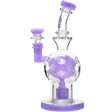 The Calibear Exosphere Seed Of Life Dab Rig is a clear borosilicate glass dab rig with light purple accents, a curved neck, and a spherical chamber with decorative holes for a unique appearance.