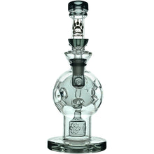 The Calibear Exosphere Seed Of Life Dab Rig is a clear borosilicate glass piece with a round base, cylindrical neck, decorative bear paw logo, artistic accents, and a Seed of Life percolator for smoother hits.