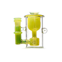A close-up of the Calibear Kickback Opal Incycler Dab Rig, featuring yellow and green accents, cylindrical chambers, a side handle, and intricate internal glasswork, set against a white background.