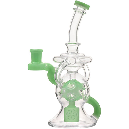 The Calibear Infinity Loop Seed Of Life Klein Recycler is a clear borosilicate glass water pipe with green accents, a curved neck, handle, and circular design inspired by the Seed Of Life motif.