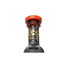 Close-up of the neck of a Calibear WigWag Seed Of Life Percolator Incycler Dab Rig, featuring a red cap, gold bear paw print, CALIBEARS text, and a vibrant swirled wig wag color design on the glass.