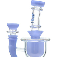 A close-up of the Calibear Vortex Seed Of Life Recycler Dab Rig, showcasing its light purple accents and clear body with curved and cylindrical shapes, set against a white background.