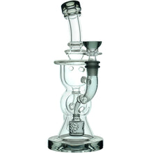 The Calibear Vortex Seed Of Life Recycler Dab Rig features clear glass, a cylindrical base, multiple chambers, a Seed of Life percolator, a side-mounted bowl, and a curved neck that extends upward.