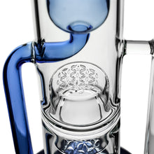 Close-up of the Calibear Pillar Flower Of Life Klein Bong with blue accents, highlighting its intricate Flower of Life percolator and multiple small holes in the chamber for enhanced filtration.