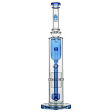 The Calibear Pillar Flower Of Life Klein Bong is a clear glass water pipe with blue accents, a cylindrical body, wide base, multiple filtration chambers including a Flower of Life percolator, and the Bear Mountain Studios logo by the mouthpiece.
