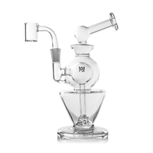 The MJ Arsenal Gemini Mini Dab Rig is made from durable borosilicate glass with a spherical chamber, angled mouthpiece, and wide conical base. This portable rig includes a joint, banger attachment, and a small logo on the main chamber.
