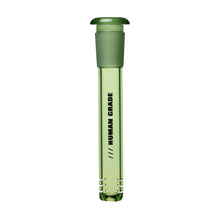The Human Grade Color Downstems (14MM) is a green glass downstem with a rounded cap and "HUMAN GRADE" printed vertically, ideal for optimal airflow or as a 14mm water pipe replacement.