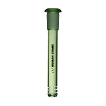 The Human Grade Color Downstems (14MM) is a green transparent glass downstem replacement with a rounded top, three horizontal slits for airflow, and "HUMAN GRADE" printed vertically. Fits most 14mm water pipes.