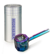 The Red Eye Tek 4.5" Infinity Bowl (Octagon), a colorful iridescent borosilicate glass pipe with REDEYETECH on the handle, sits before a tall silver cylindrical container with a grid pattern and matching REDEYETECH logo.