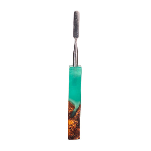 The MJ Arsenal Stabwood Dab Tool features a stainless steel sculpting tip and a textured handle crafted from turquoise resin blended with brown wood, shown isolated on a white background.