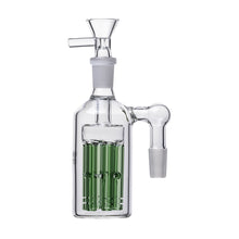 The Jellyfish Glass Ash Catcher 14mm (45/90 degree) features clear glass, a side arm, and green jellyfish perc tubes inside for enhanced water filtration with your bong or water pipe.