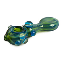 The Red Eye Glass 5" Middle Man Pipe is a durable borosilicate glass pipe featuring green and blue colors, a rounded bowl, and decorative side bubbles. Designed for smoking, it offers both style and reliability.
