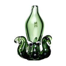 The Octopus Carb Cap is a green borosilicate glass sculpture shaped like an octopus, featuring curled tentacles, white suction cup details, a smooth bottle-like body, and an engraved symbol—perfect as a unique dab accessory.