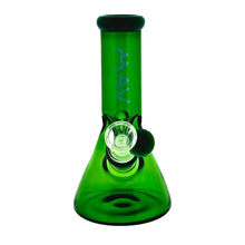 The MAV 7" Two-Tone Mini Beaker is a green borosilicate glass water pipe with "MAV" etched vertically on the neck, featuring a clear 14mm male glass bowl and downstem.