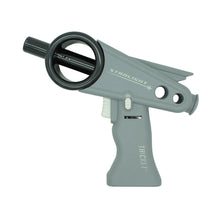 The Thicket Starlight Torch is a gray toy ray gun with black accents, labeled STARLIGHT and THICKET, featuring a futuristic circular barrel element and a white trigger—resembling a novelty torch lighter.