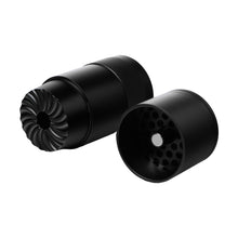 The MJ Arsenal Capsule Grinder Dugout, a black metal cylindrical portable herb grinder, is shown in two separated parts: one with sharp spiral teeth and the other with holes and a central magnet for easy alignment.