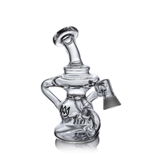 The MJ Arsenal Hydra Vape Edition is a clear glass mini dab rig with a curvy design, wide base, angled neck, chain-like accent, splash-resistant function, removable bowl, and a black decorative logo on the side.