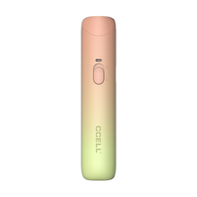 The CCELL Go Stik Battery is a compact, cylindrical vape pen with a gradient peach-to-green design, a central sliding switch, and the CCELL brand name printed vertically near the base.