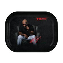 The Tyson 2.0 Rolling Tray is a rectangular tray featuring a bald man seated in a black chair, wearing a black shirt and white pants, with the iconic TYSON logo and red signature set against a dark background.