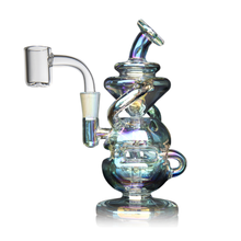 The MJ Arsenal Infinity Mini Dab Rig is a colorful, iridescent piece made from borosilicate glass with a curvy design, side handle, and angled mouthpiece, shown on a white background.