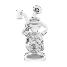 The MJ Arsenal Infinity Mini Dab Rig is a clear borosilicate glass piece with intricate curves, multiple chambers, a side spout, and stands upright on a round base.