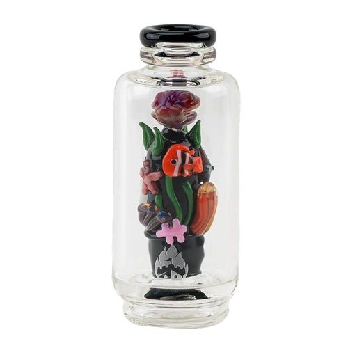 The Empire Glass Works Save the Seas Peak Top is a clear glass Puffco Peak attachment with a black lid, featuring colorful glass flowers, leaves, and a mushroom on a black base, plus glow-in-the-dark accents.