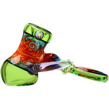 The Calibear Horned Wig Wag Hammer Pipe features swirled orange, red, and blue patterns with a green chamber and mouthpiece. Made from durable borosilicate glass, it delivers a smooth smoking experience.