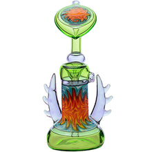 The Calibear Horned Wig Wag Upright Bubbler features a green base, orange, red, and blue swirling patterns, translucent side wings, and a sunburst top. Crafted from borosilicate glass.