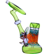 The Calibear Horned Wig Wag Upright Bubbler features borosilicate glass with a green base and neck, swirling orange, blue, and yellow patterns, plus decorative glass spikes along the side.