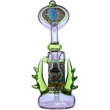 The Calibear Horned Wig Wag Upright Bubbler features a bulbous base, swirling patterns, green spiked accents, and durable borosilicate glass with a pinhole diffuser perc. Shown upright against a white background.