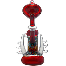 The Calibear Horned Wig Wag Upright Bubbler features a red hue, thick base, swirling central patterns, and clear glass horn-like spikes, crafted from durable borosilicate glass for lasting style and function.