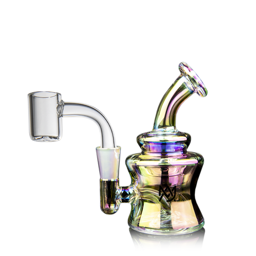 The MJ Arsenal Jammer Mini Dab Rig is a small, iridescent borosilicate glass piece with a bent mouthpiece and clear quartz banger, shown against a white background.