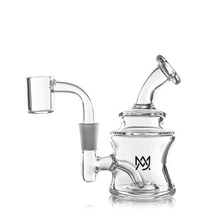 The MJ Arsenal Jammer Mini Dab Rig is a clear borosilicate glass dab rig with a cylindrical base, angled mouthpiece, side arm, visible percolator, and a black crown-like logo on the main chamber set against a white background.