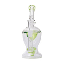 The Human Grade The Nuke Glass Rig is a clear borosilicate dab rig with green accents, featuring a cylindrical base, mushroom cloud perc for smooth hits, and intricate internal glasswork for top performance.