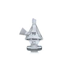 The MJ Arsenal King Bubbler is a clear borosilicate glass piece shaped like a sailboat, featuring a wide base for water filtration, an angled mouthpiece, and a sail displaying the MV logo, all set against a white background.
