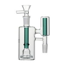 The Human Grade The Inverter Ash Catcher is a clear glass bong attachment with green accents, multiple chambers, a percolator for filtration, designed for 14mm water pipes. It includes a flower bowl on top and extra side tubes.