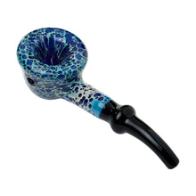 The Human Grade Fleur Hand Pipe is made of borosilicate glass with a speckled blue and white bowl, black stem, and curved mouthpiece, showcasing classic pipe design against a white background.