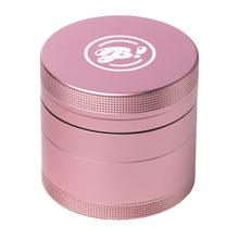 The BIGFUN! Medium Grinder is a metallic pink aluminum grinder with a textured grip and a white stylized logo on the lid, shown against a white background.