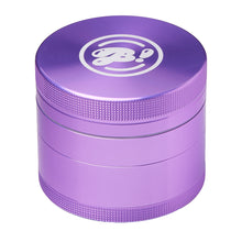 The BIGFUN! Large Grinder is an aluminum grinder with a metallic purple finish, textured grip, and a white circular logo on the lid. It features a built-in pollen sift and is displayed against a white background.