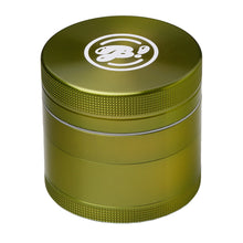 The BIGFUN! Medium Grinder is metallic green aluminum with a textured grip and white logo on top, plus a pollen sift chamber. It’s shown against a white background.