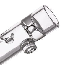 Close-up view of the MJ Arsenal - Alpine Series - Ridge Chillum Taster One Hitter, featuring a cylindrical attachment and rounded edges, crafted from borosilicate glass and shown against a white background.