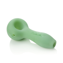 The Grav Sandblasted Spoon features a deep, rounded bowl and curved stem in light green matte silicone, with the GRAV logo embossed on the side. Its stylish design offers a functional smoke and echoes the popular original spoon style.