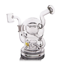 The MJ Arsenal The Plasma Core Rig is a clear borosilicate glass water pipe with curved, interconnected tubes and a wide round base. It has opposite-side mouthpiece and bowl attachments for smooth smoking, inspired by the Plasma Core Dab Rig.