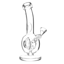 The MJ Arsenal Saturn Water Pipe is a clear borosilicate glass mini rig with a round chamber, angled neck, side bowl, and flat circular base—ideal for smooth, compact sessions.