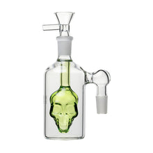 The 14mm Skull Ash Catcher 45° or 90° features a clear glass design with a green skull inside the chamber, an angled mouthpiece, and 14mm joint connectors on both sides.