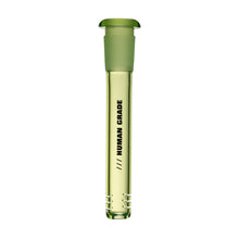 A transparent glass vial with a green cap, partially filled with yellow liquid. "HUMAN GRADE" is printed vertically in black, echoing the sleek design of the Human Grade Color Downstems (14MM) for optimal airflow.