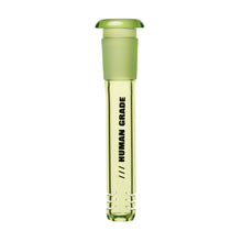The Human Grade Color Downstem (14MM) is a transparent green glass vial with a closed top, featuring "HUMAN GRADE" printed vertically in black. Designed for optimal airflow, it's perfect as a 14mm water pipe downstem replacement on a white background.
