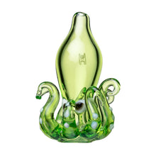 The Octopus Carb Cap is a green borosilicate glass accessory with a sleek, elongated center and tentacle-like extensions dotted in white, resembling an abstract octopus—ideal as a unique dab tool.