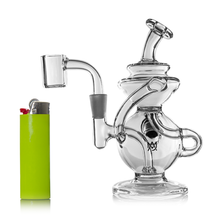 The MJ Arsenal Mini Jig Mini Dab Rig, featuring multiple chambers and curved tubes, is displayed next to a green lighter with a red button on a white background, showcasing the dab rig's compact and sleek design.